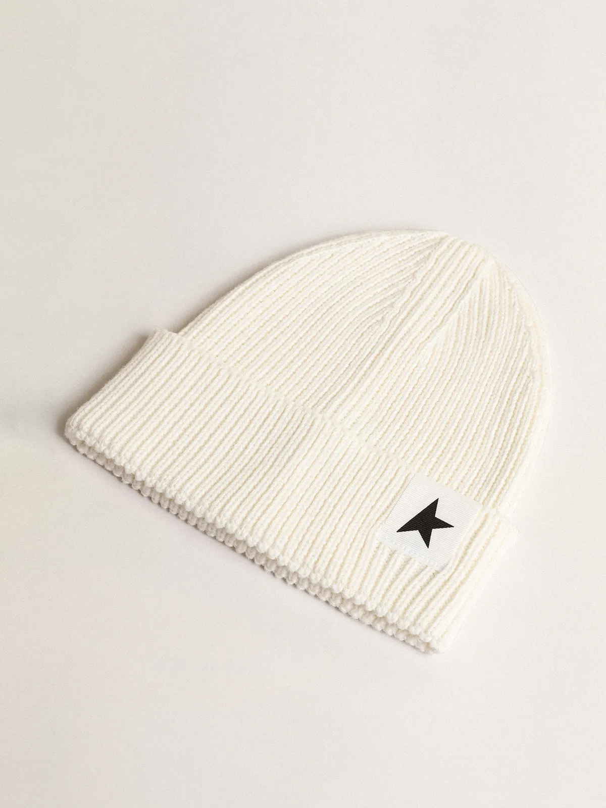 Off-white cotton beanie with contrasting black star